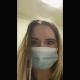 A blonde girl wearing a mask records herself pissing and taking a massive shit while bending over in front of a toilet in a public restroom. She wipes when finished. Vertical format video. About 2 minutes.